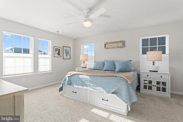 bedroom with ceiling fan and light colored carpet