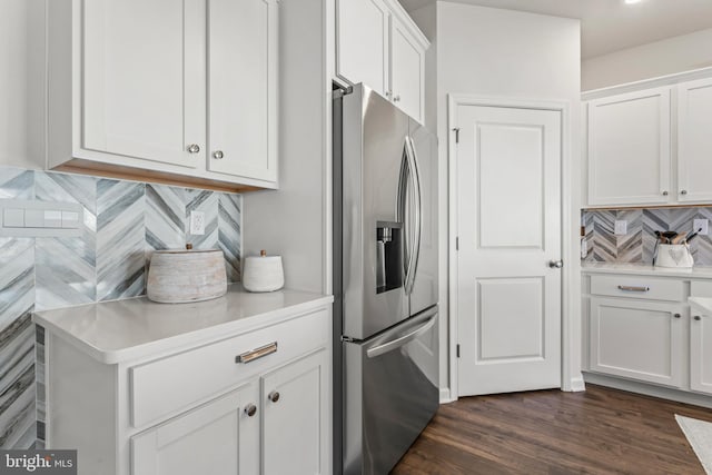 kitchen featuring stainless steel fridge with ice dispenser, dark hardwood / wood-style floors, tasteful backsplash, and white cabinetry