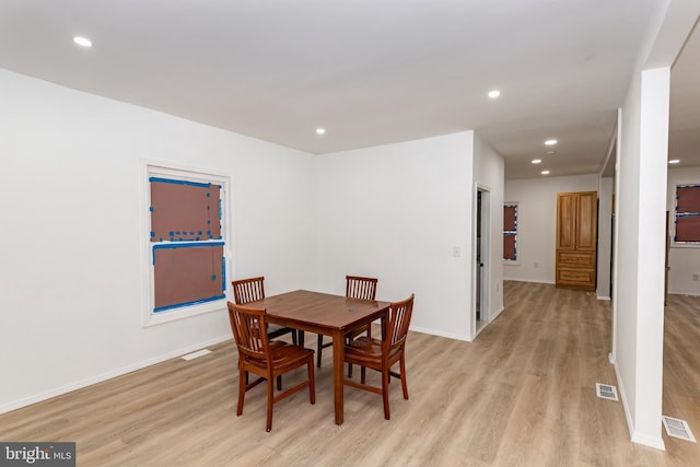 dining space with light wood-type flooring