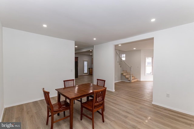 dining space featuring light hardwood / wood-style floors