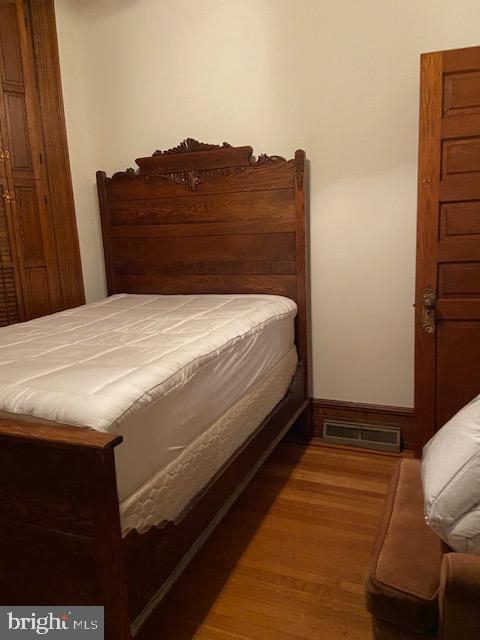 bedroom featuring hardwood / wood-style floors