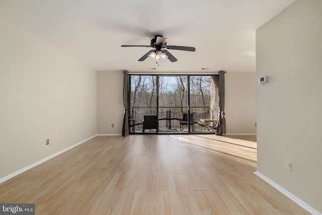 unfurnished living room featuring ceiling fan and light hardwood / wood-style floors