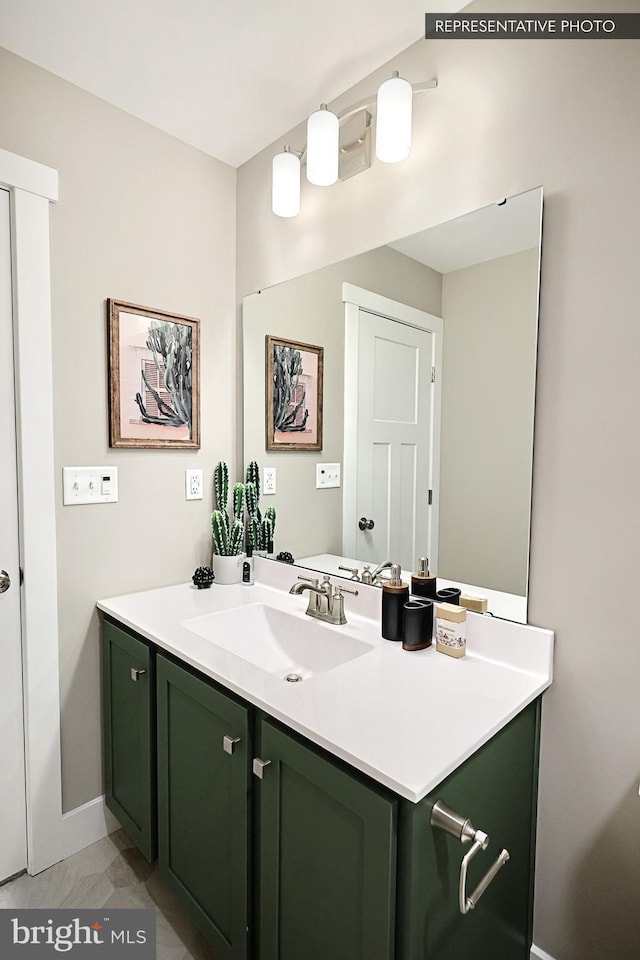 bathroom featuring vanity and baseboards