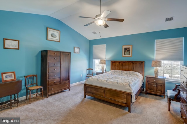 carpeted bedroom with ceiling fan and vaulted ceiling