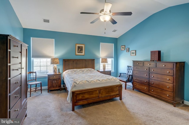 bedroom with ceiling fan, light carpet, and lofted ceiling