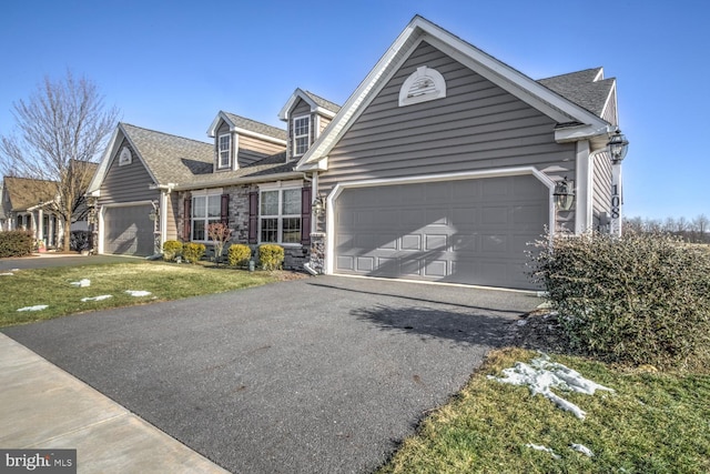 view of front of house featuring a front yard and a garage