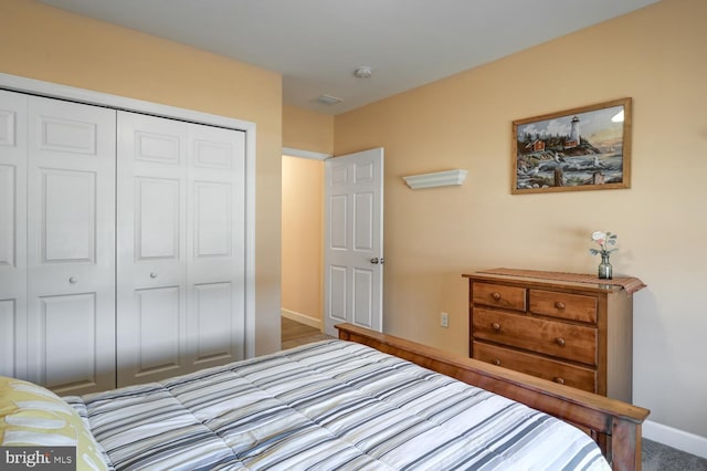 carpeted bedroom featuring a closet