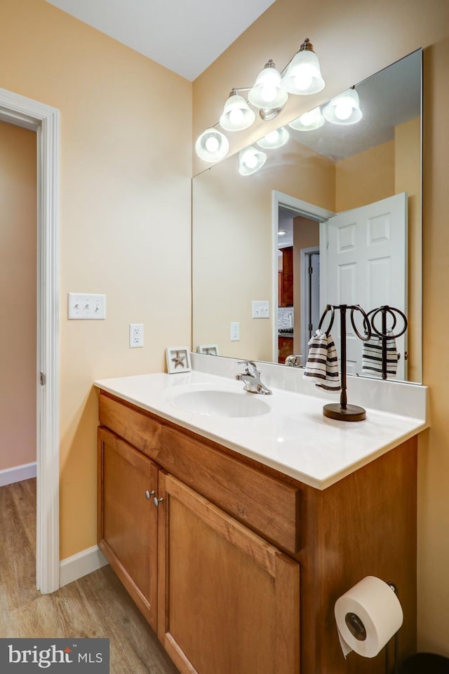 bathroom featuring vanity and hardwood / wood-style flooring