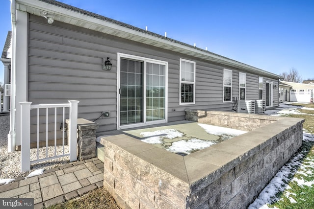 rear view of house with cooling unit and a patio area