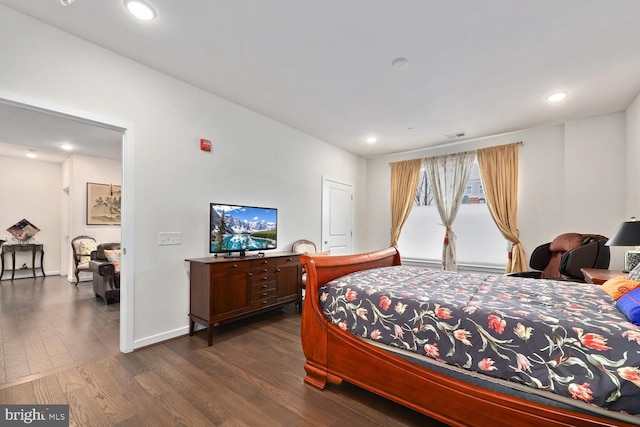 bedroom featuring dark hardwood / wood-style floors