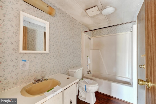 full bathroom featuring shower / tub combination, toilet, hardwood / wood-style flooring, and vanity