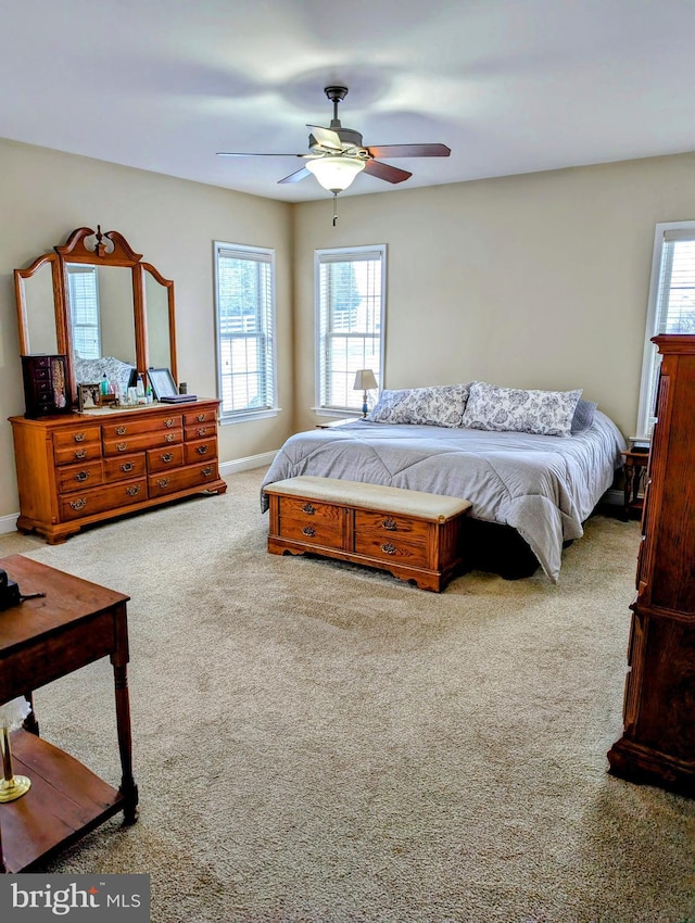 bedroom with light carpet and ceiling fan