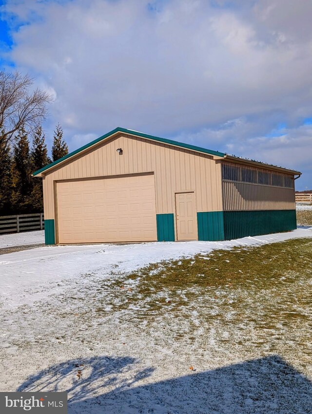 view of snow covered garage