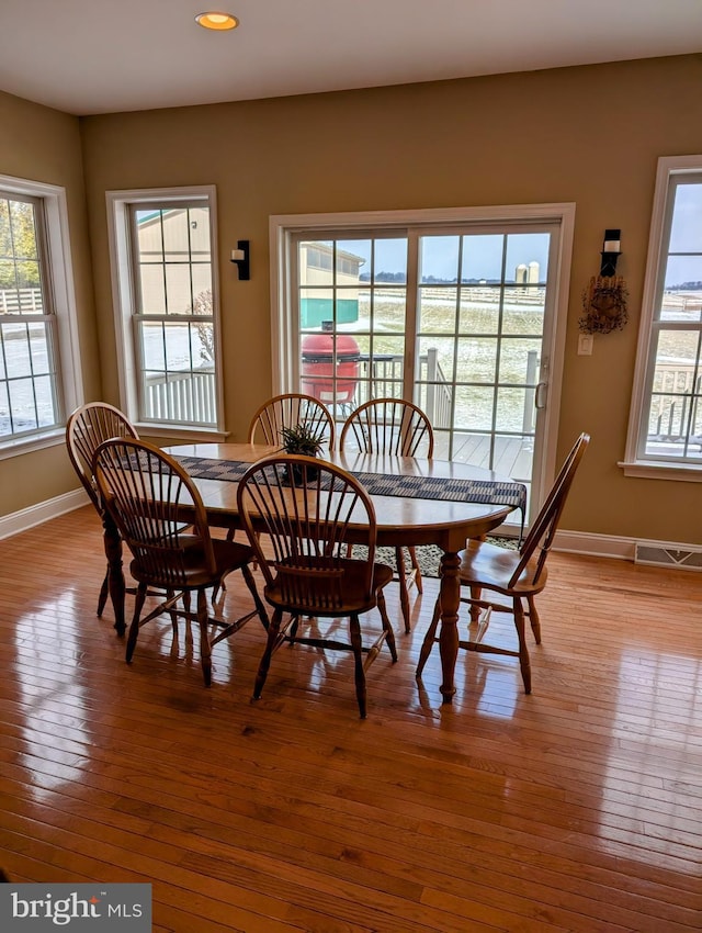 dining room with light hardwood / wood-style floors