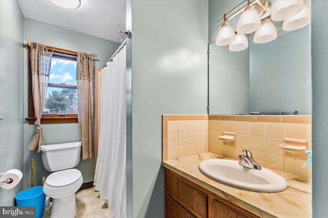 bathroom featuring curtained shower, backsplash, vanity, and toilet