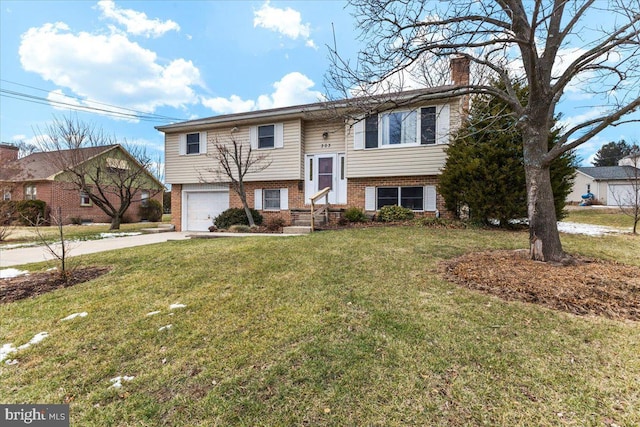 split foyer home featuring a front lawn and a garage