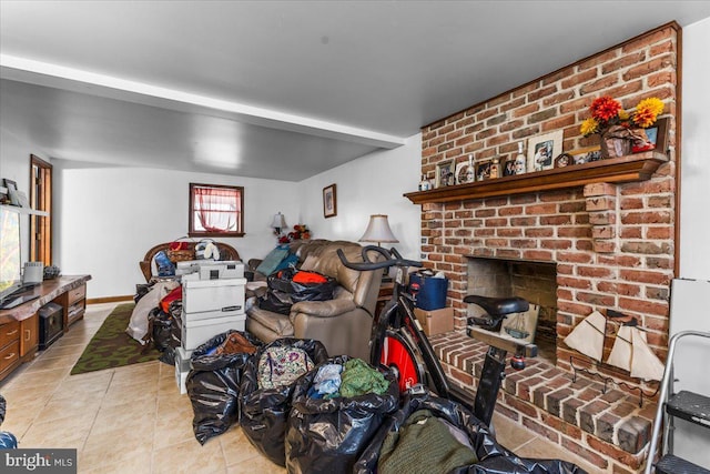 living room featuring a brick fireplace and light tile patterned flooring