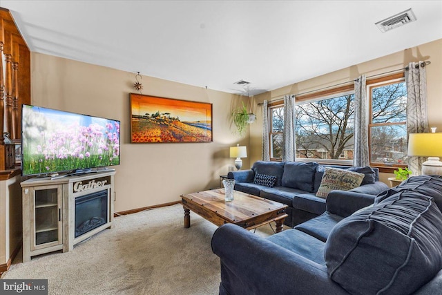 living room featuring a wealth of natural light and light carpet