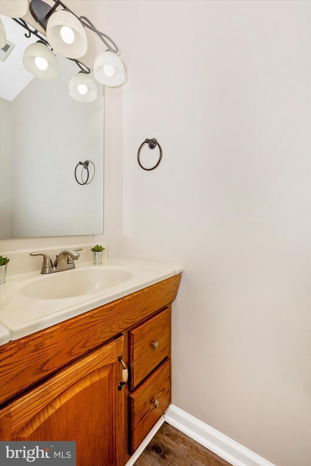 bathroom with vanity and hardwood / wood-style flooring