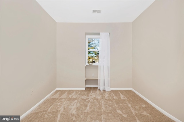 spare room with light colored carpet