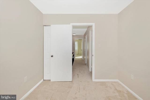 unfurnished bedroom with light carpet