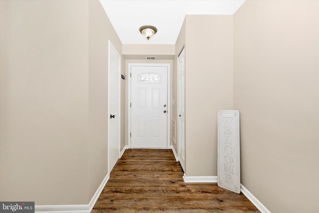 doorway with dark hardwood / wood-style flooring