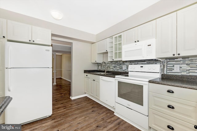 kitchen with sink, dark hardwood / wood-style flooring, white appliances, and white cabinets