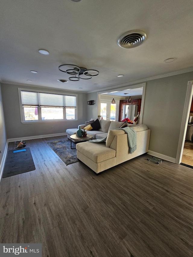 unfurnished living room featuring dark hardwood / wood-style floors, ceiling fan, and crown molding