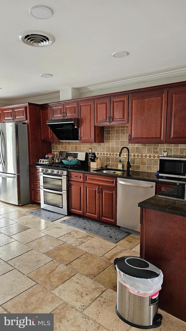 kitchen featuring crown molding, sink, appliances with stainless steel finishes, and tasteful backsplash