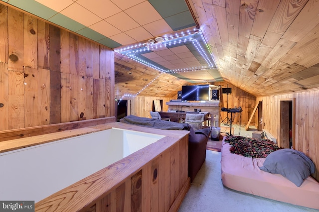 bonus room with wooden walls, vaulted ceiling, and wood ceiling