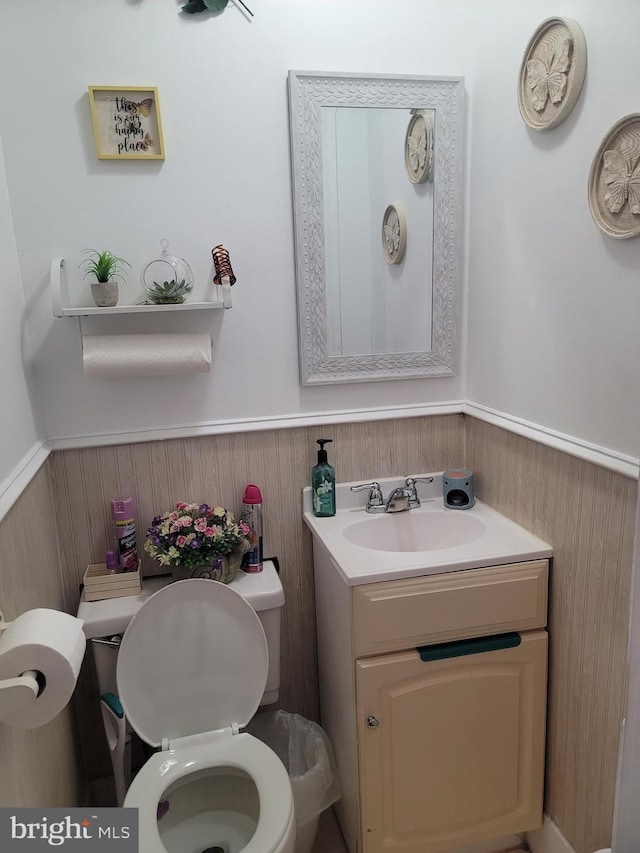 bathroom featuring toilet and vanity