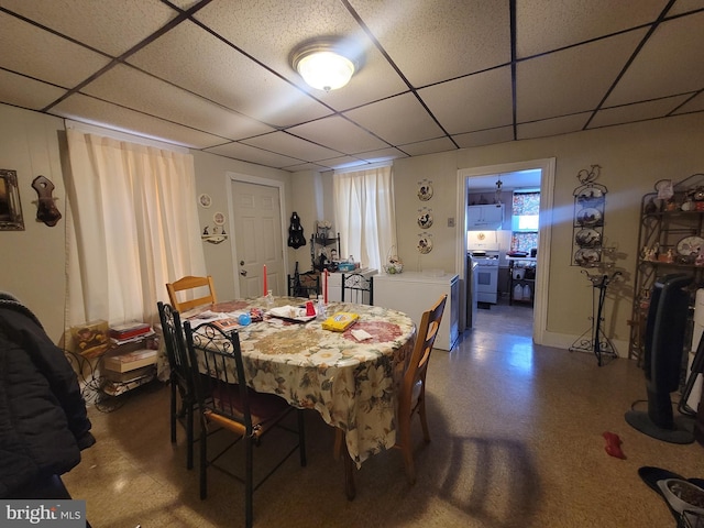 dining area with a paneled ceiling