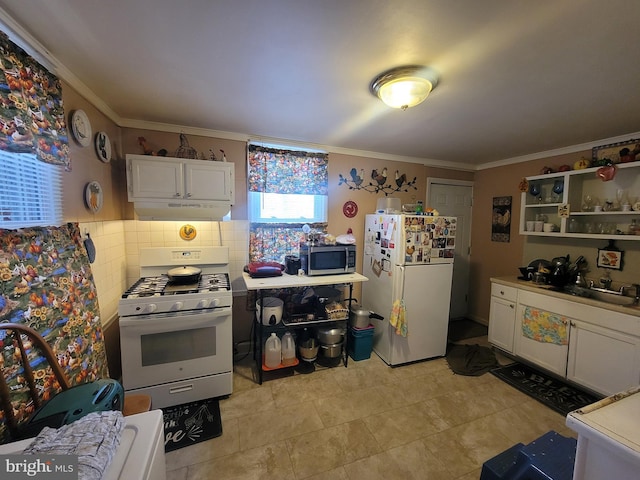 kitchen featuring white appliances, white cabinets, ornamental molding, and decorative backsplash