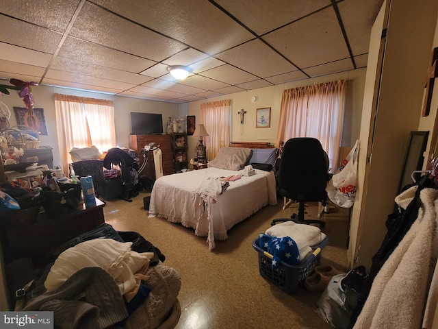 bedroom featuring a paneled ceiling