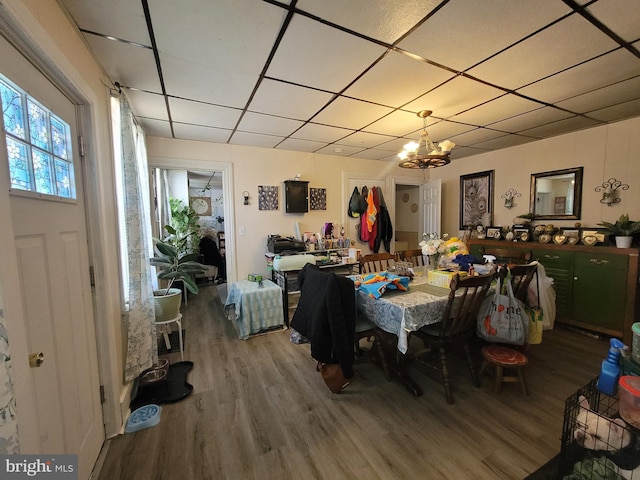 dining space featuring a chandelier and wood-type flooring