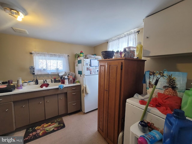 washroom with independent washer and dryer