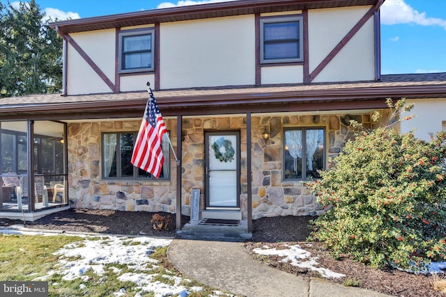 view of front of home with a sunroom