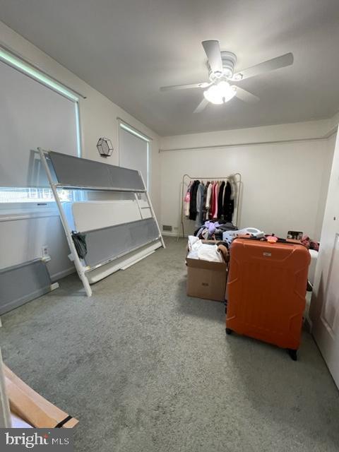 carpeted bedroom with ceiling fan