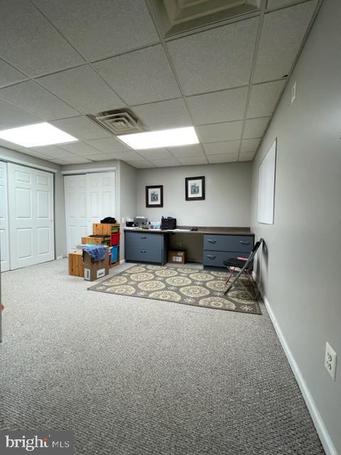 interior space featuring a paneled ceiling