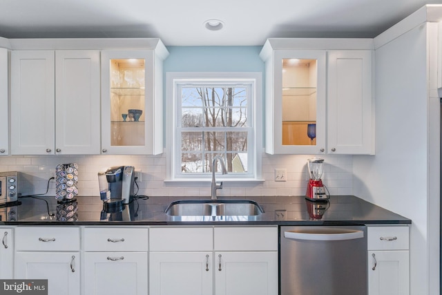 kitchen with sink, white cabinetry, and dishwasher