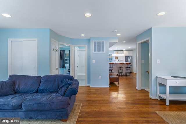 living room with dark wood-type flooring