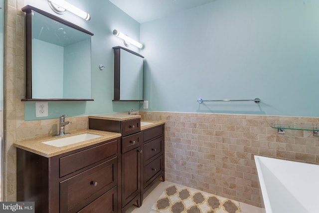 bathroom featuring tile walls and vanity