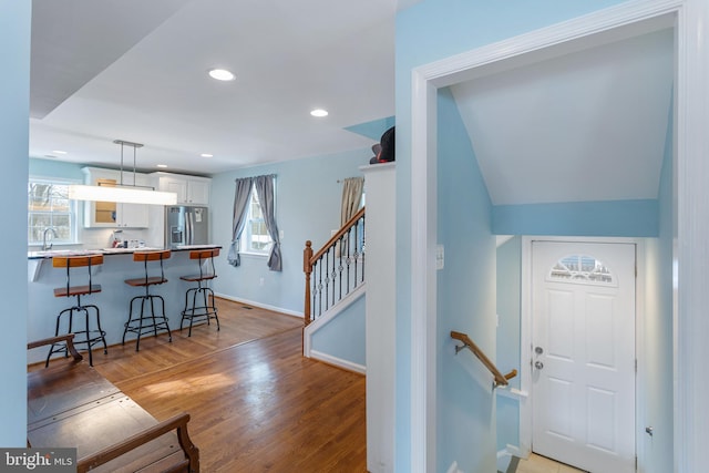 foyer featuring sink and hardwood / wood-style floors