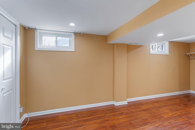 basement with hardwood / wood-style floors