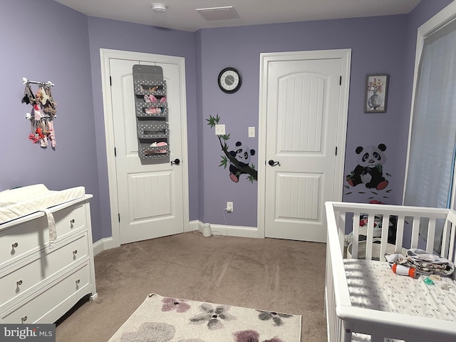 carpeted bedroom with baseboards