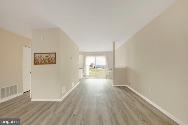 hall with light wood-type flooring