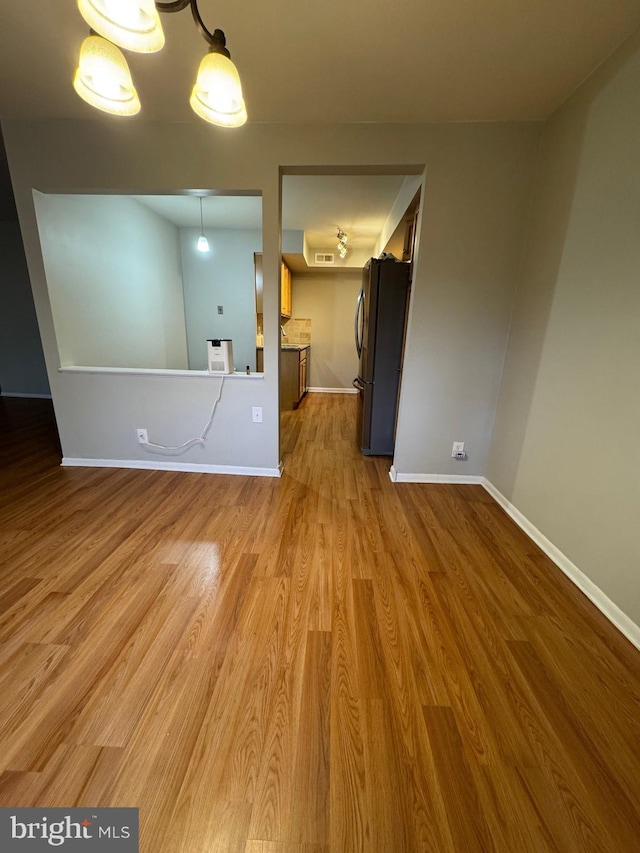 spare room with hardwood / wood-style flooring