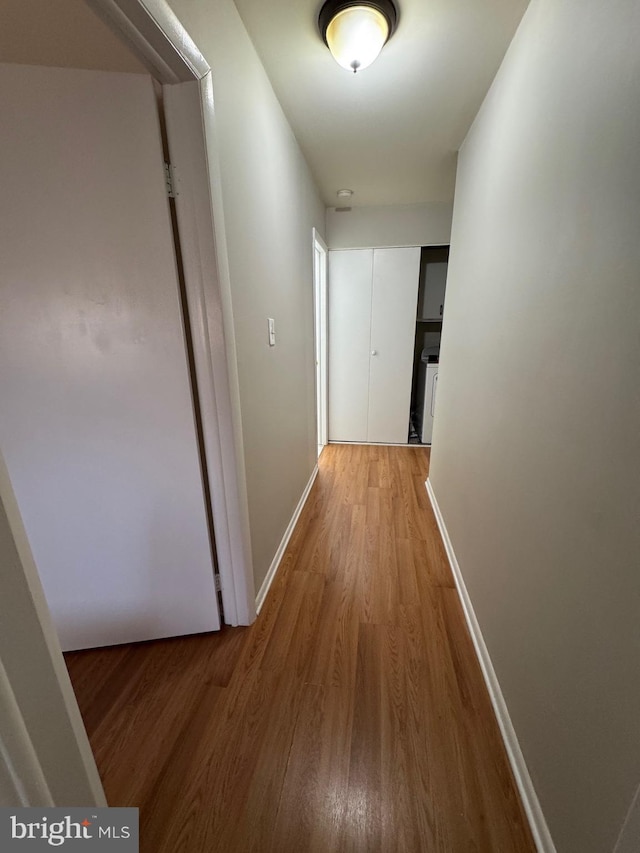 corridor featuring wood-type flooring