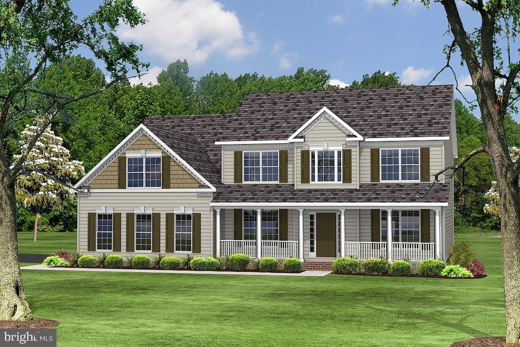 colonial home featuring a porch and a front yard