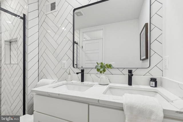 bathroom featuring tile walls and vanity